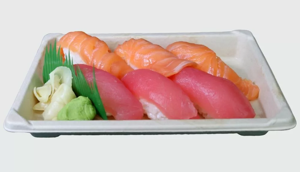 3 pieces each: salmon and tuna nigiri fish on rice with pickled ginger and wasabi on side in tray