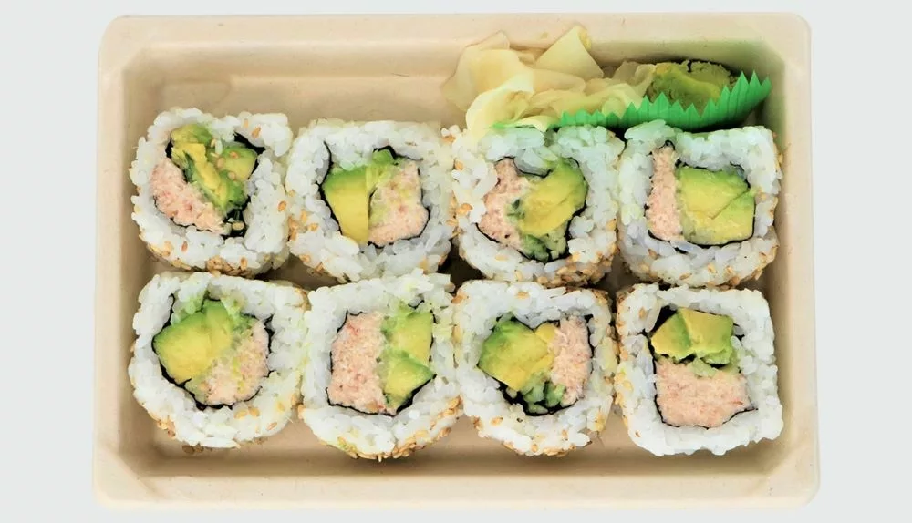 917 california roll blue crab 2 dev 8 pieces of california roll sushi with crab, avocado in rice with pickled ginger and wasabi in tray