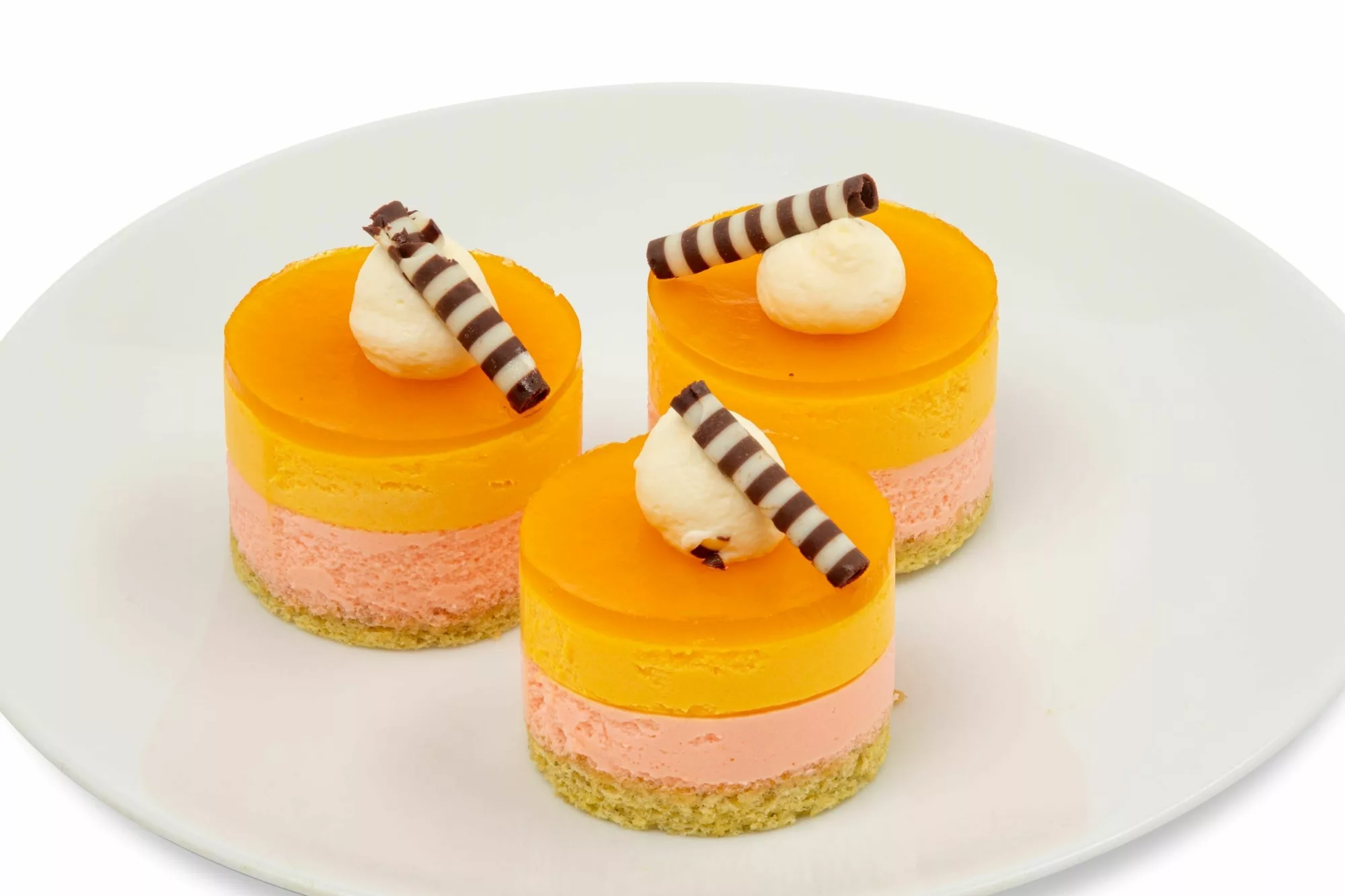 PLU 9034 Passion Fruit Blood Orange Mousse x3 Tropical passion fruit and blood orange mousse over salted toasted pepita sponge cake. Includes 6 pieces.